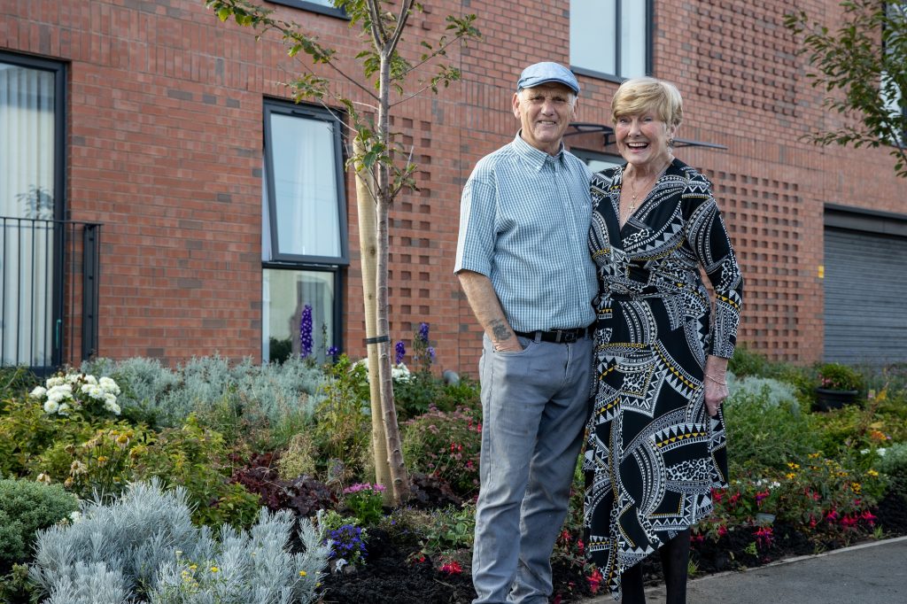 Fred and Ann outside their shared ownership apartment in New Brighton 