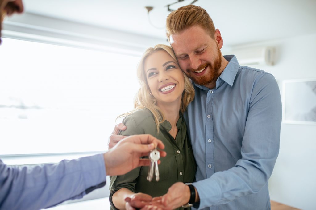 happy couple get keys to new shared ownership home